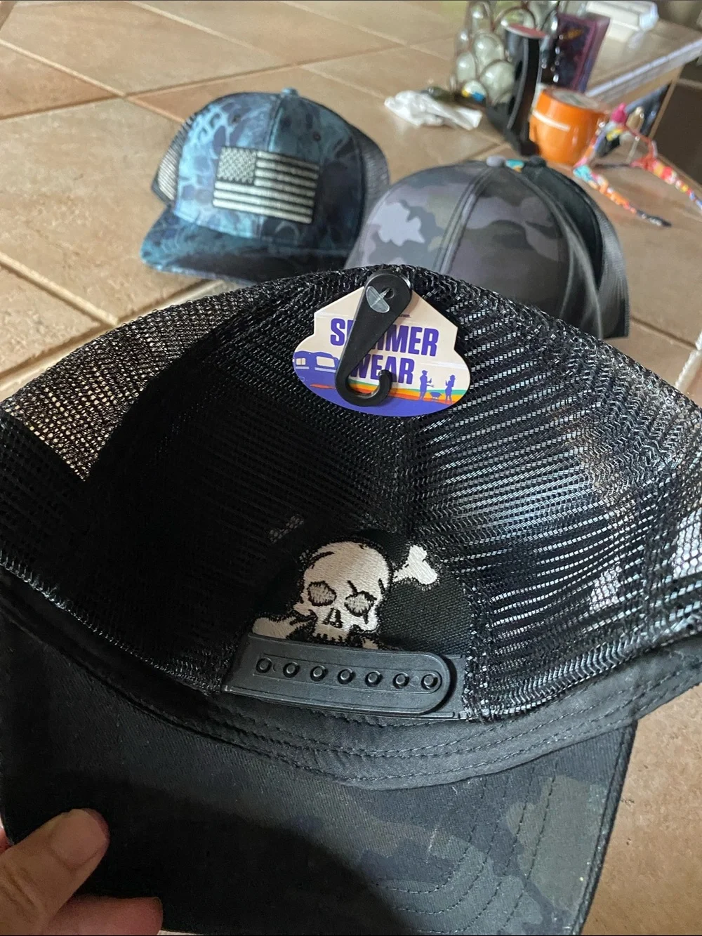 Men’s Black Trucker Hat with White Skull Patch